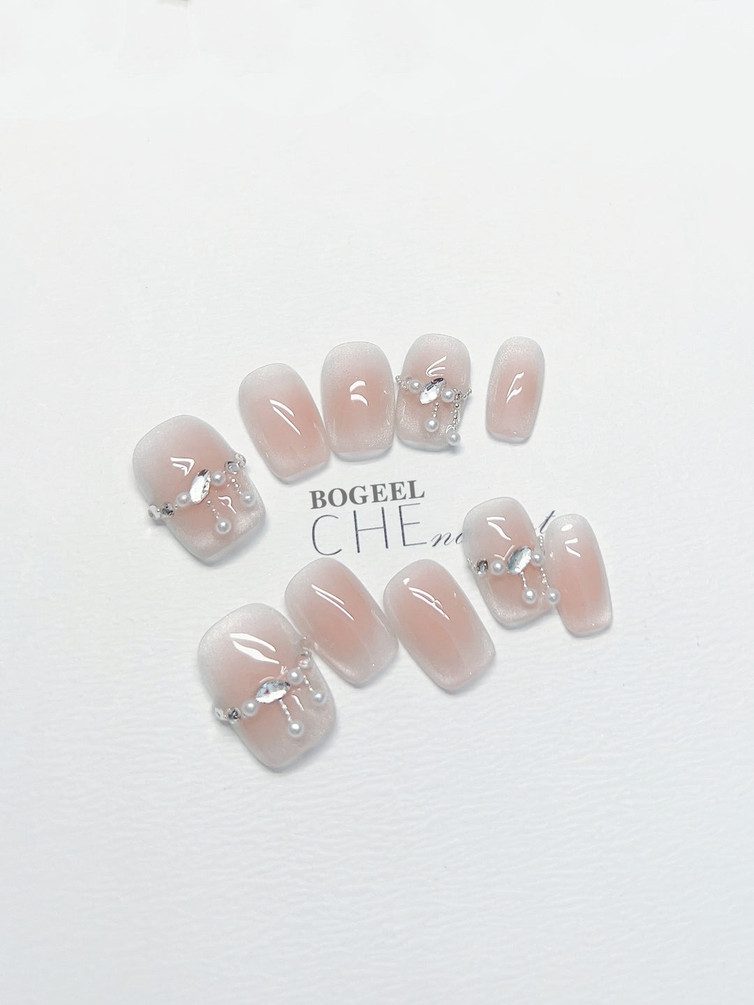 Hand-worn Nail Blush Smudges Rhinestone Short